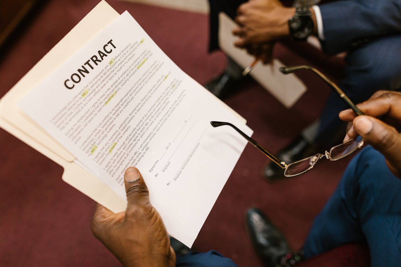 services-03 Close-up of hands holding a contract, focus on business agreement discussion.